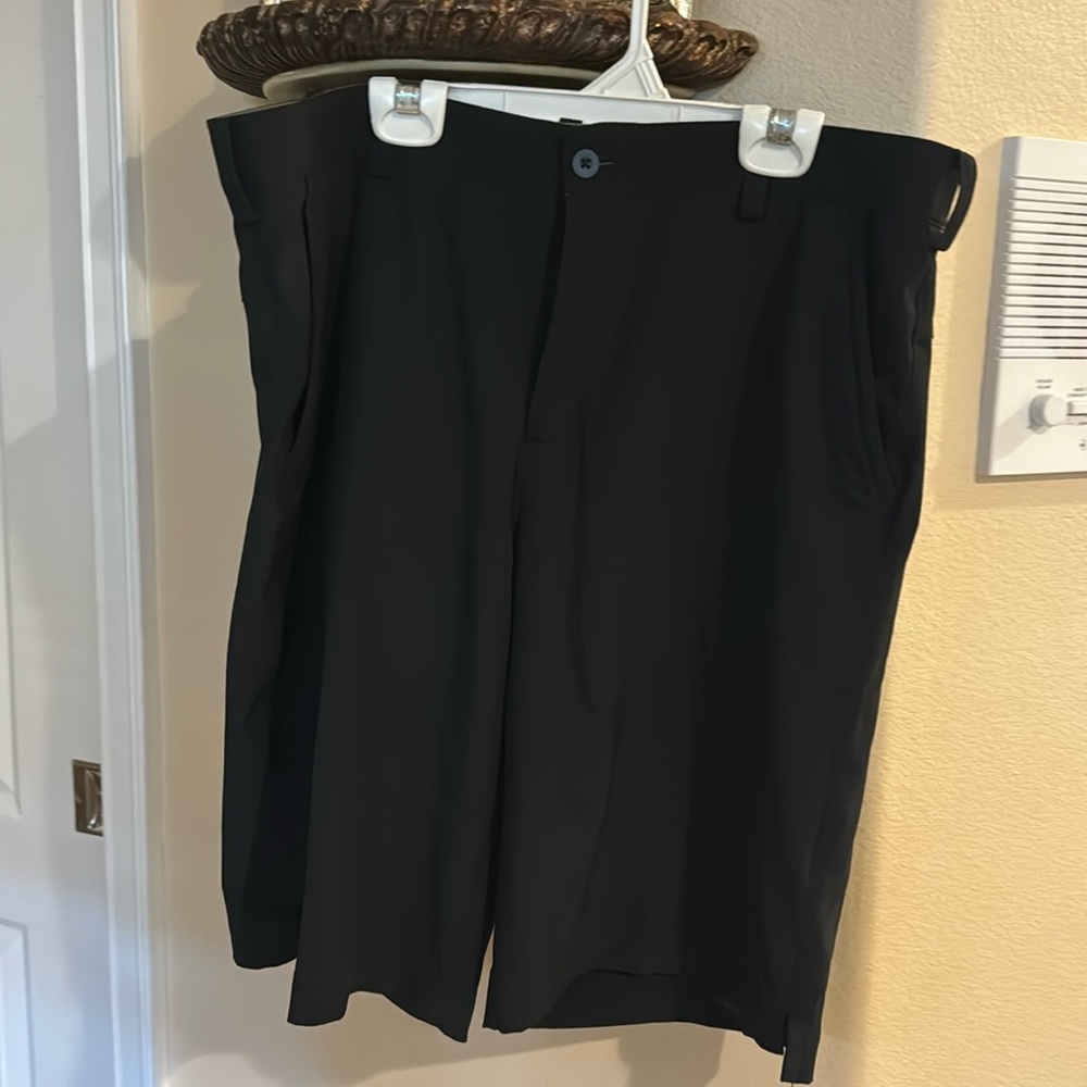 Nike and a pair of under armour golf shorts